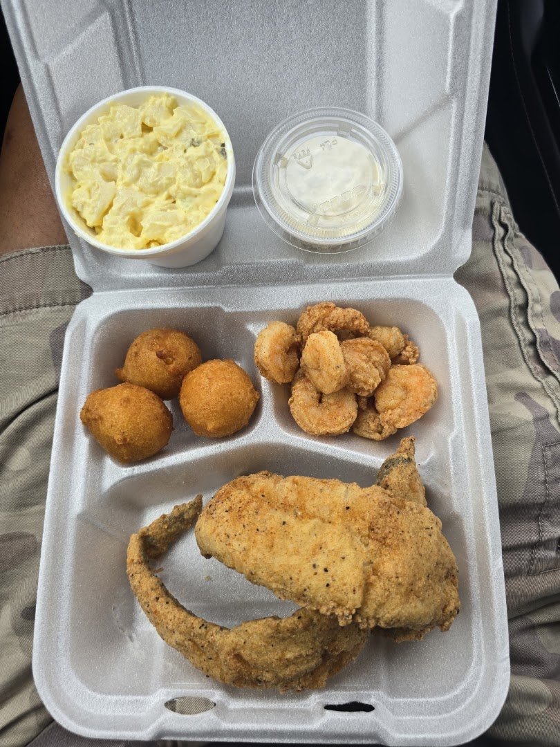 Takeout seafood trays ready for pickup.