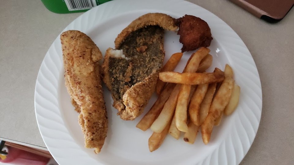 Seafood menu with fried fish combinations.
